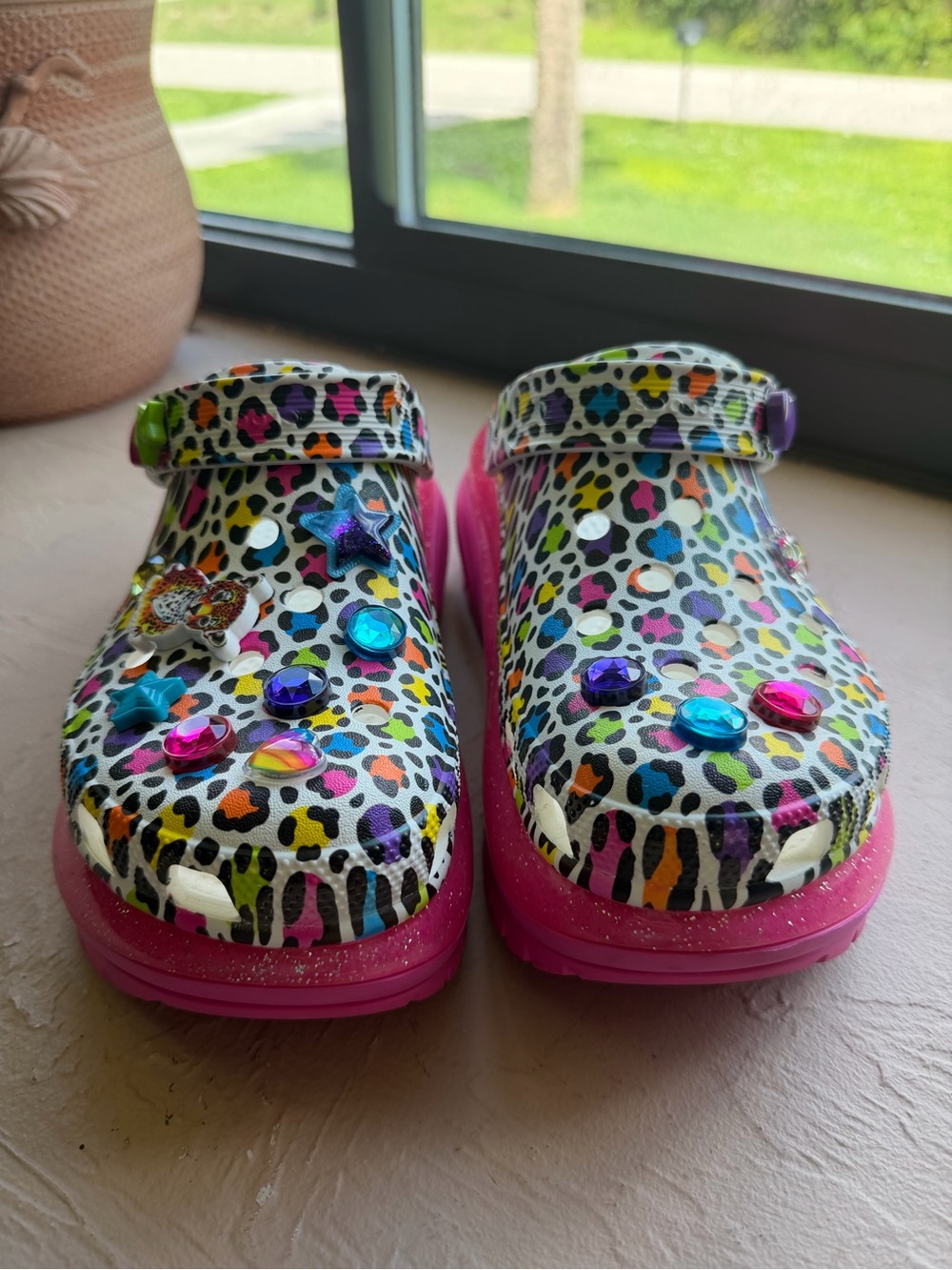 Lisa Frank Mega Crush Clogs feature a vibrant multicolor leopard print Size 10